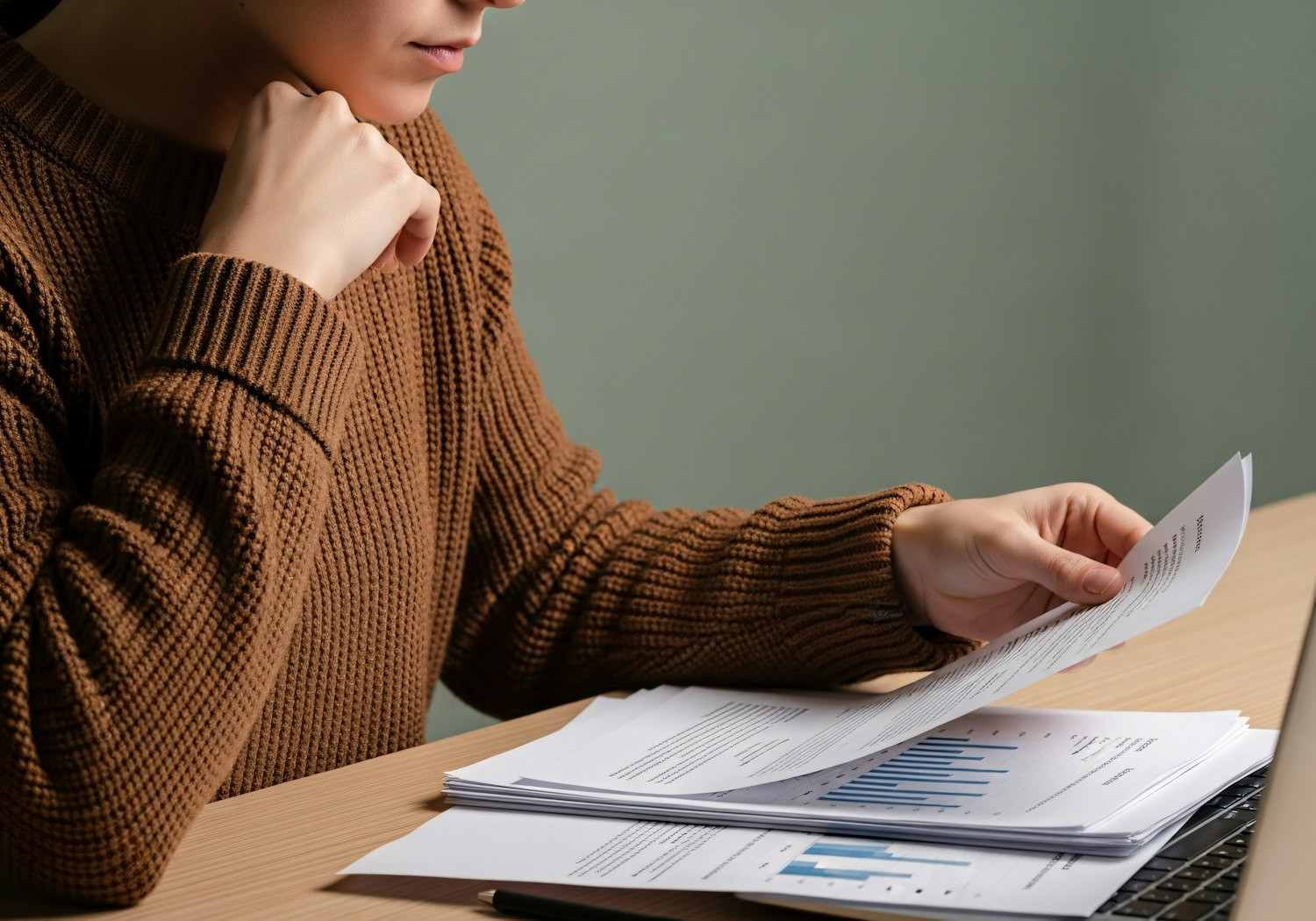 A business owner seriously reviewing documents related to data privacy and compliance regulations like POPIA.