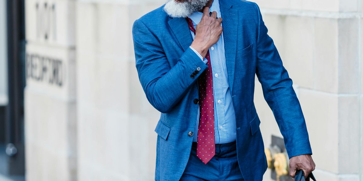 A business owner thoughtfully considering security measures and potential risks for their online presence and customer data.