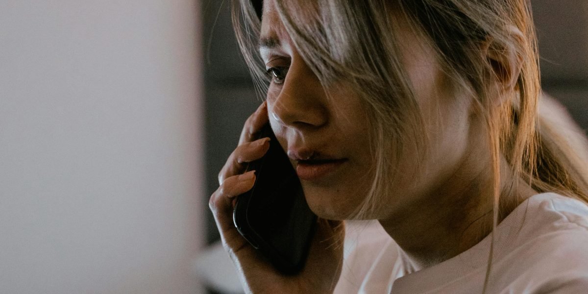 A person on a phone call, expressing frustration or seeking urgent assistance for a critical technical issue.