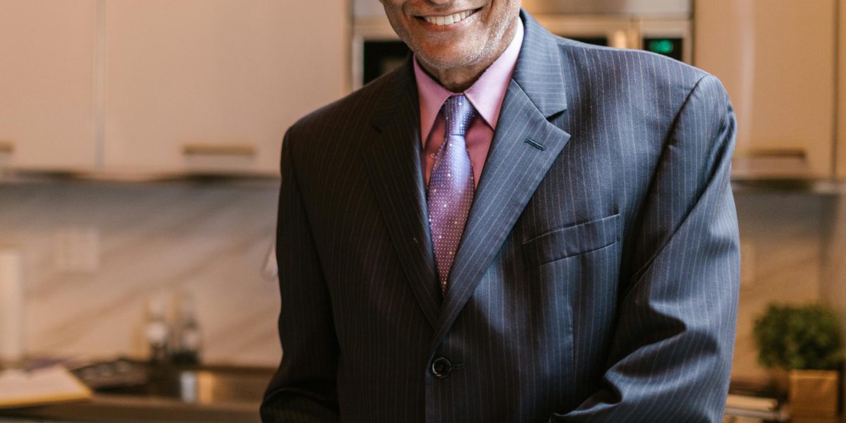 A person smiles confidently, indicating success in financial planning or decision-making.