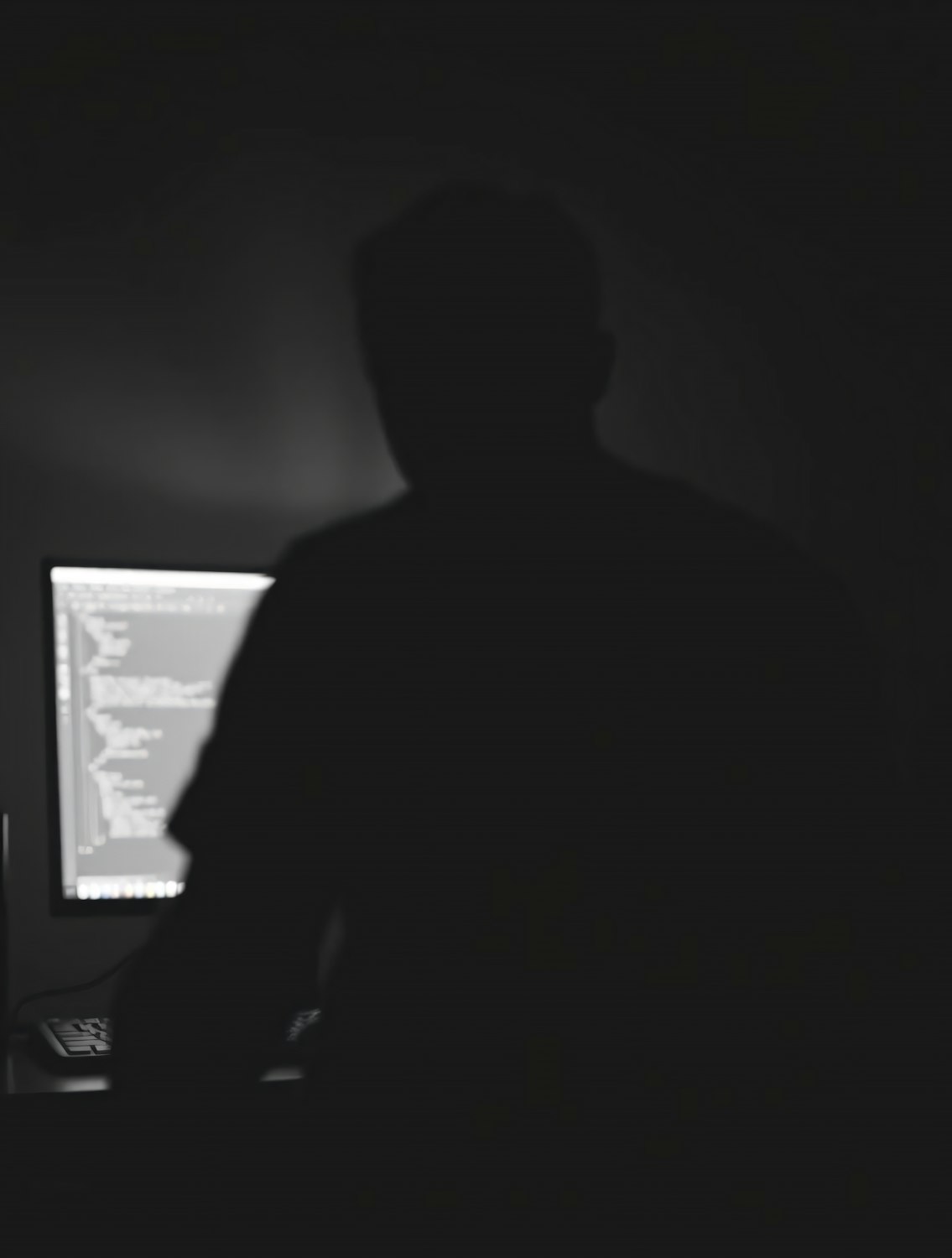 A person looking impatient as they wait for a slow-loading website on their laptop, illustrating the negative impact of poor page performance on user experience and business.