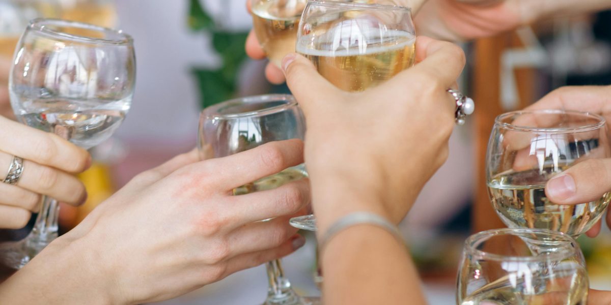 A group of happy business professionals celebrating a significant achievement or milestone, representing successful branding.