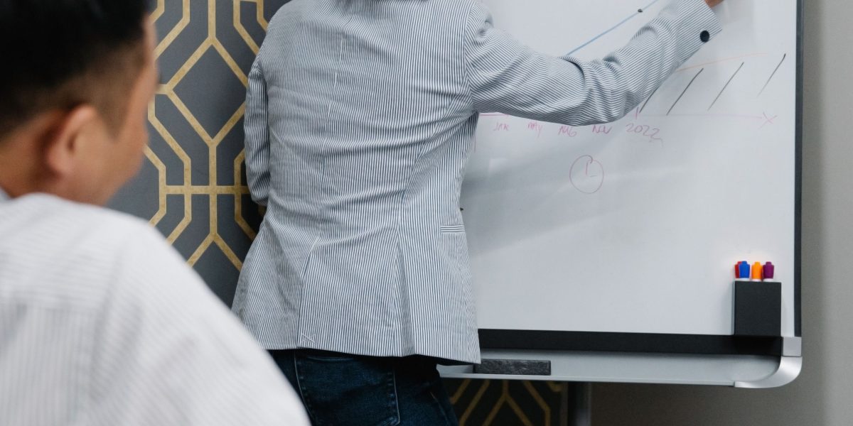 People working together to understand a complex system, much like the interplay of Notion, Vercel, and DNS.