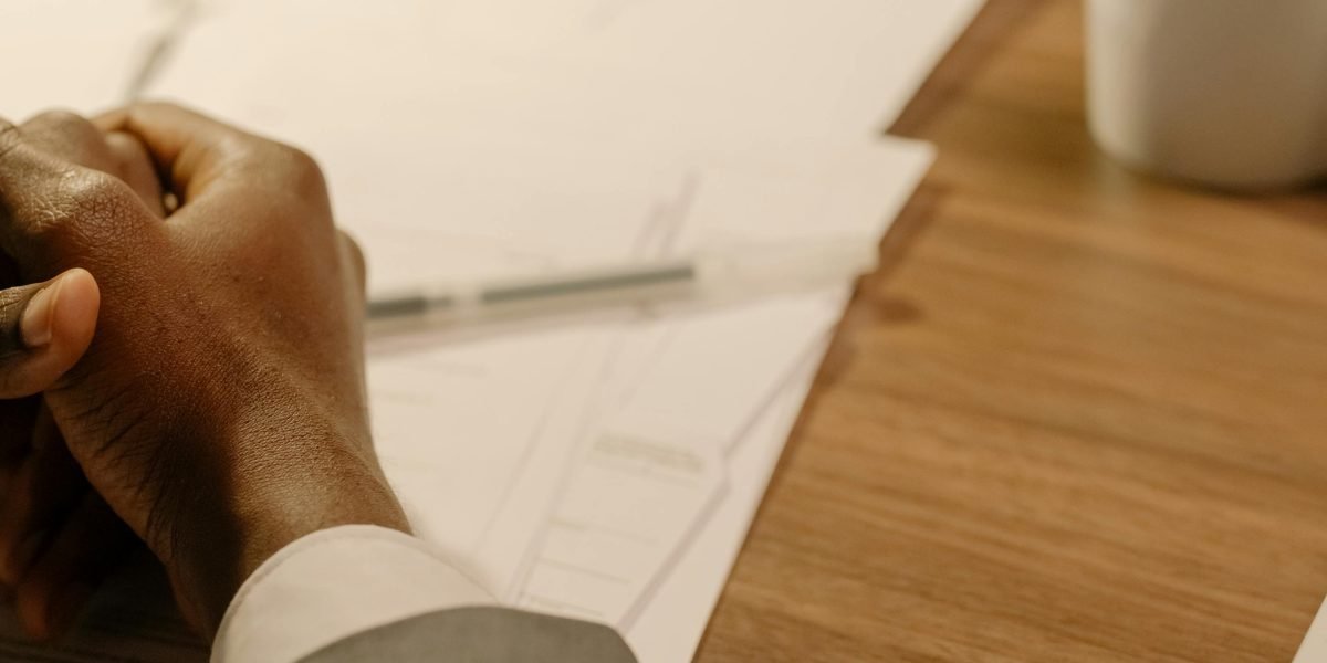 A person carefully considering options before making a crucial business decision.