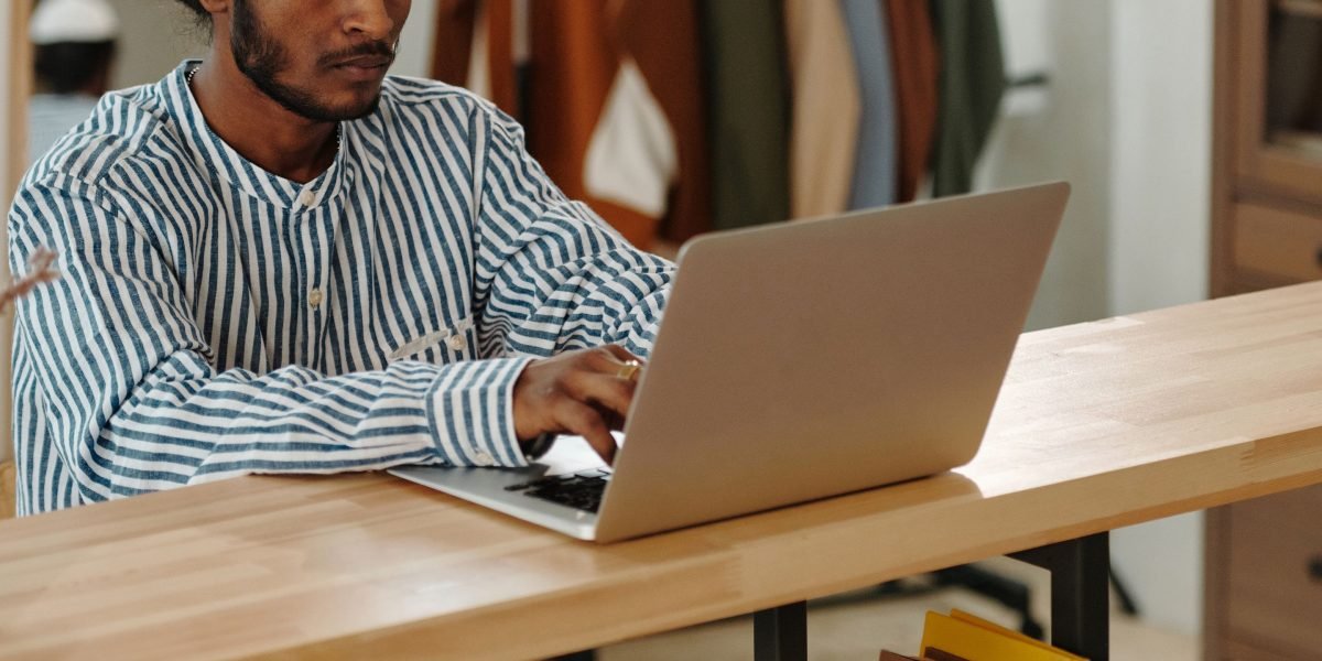 A person deeply focused in a tidy home office, symbolizing the reduced distractions and improved concentration offered by HelloTalk Web.