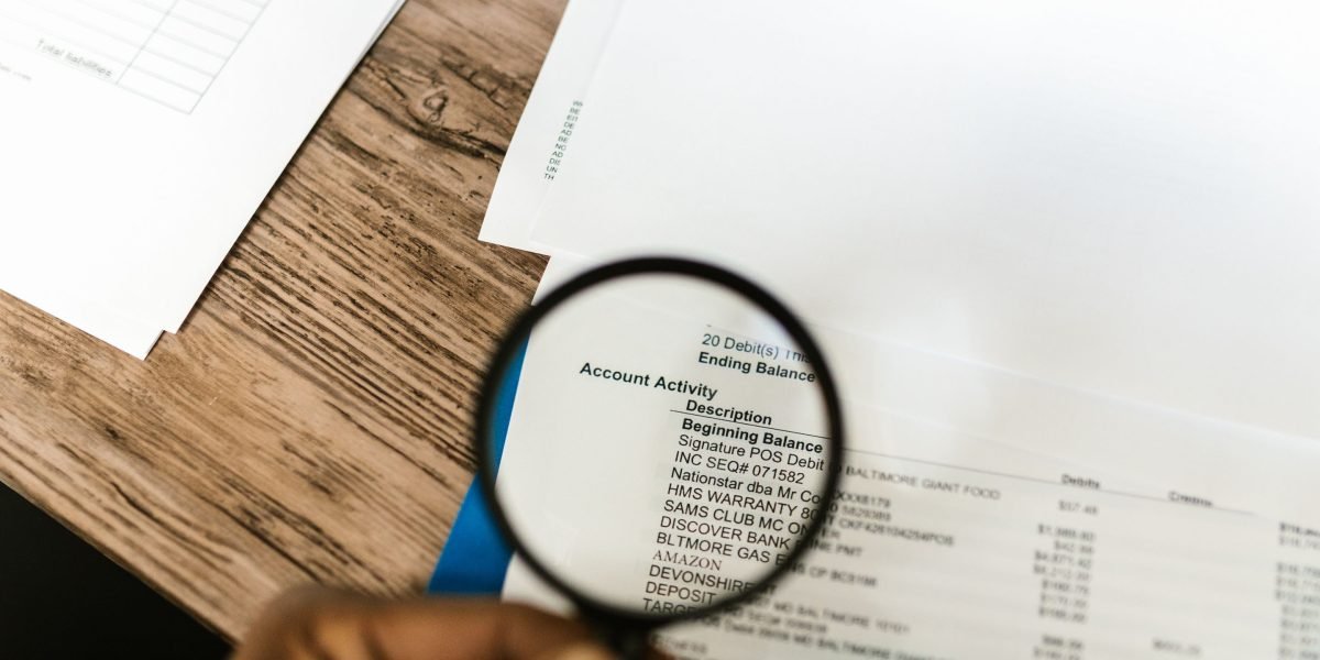 A person carefully reviewing financial documents to understand all costs before making a commitment.