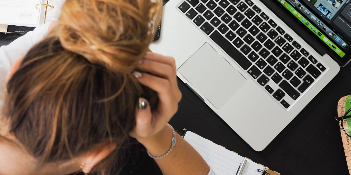 A business owner shows frustration as their website experiences slow load times during a peak traffic event.
