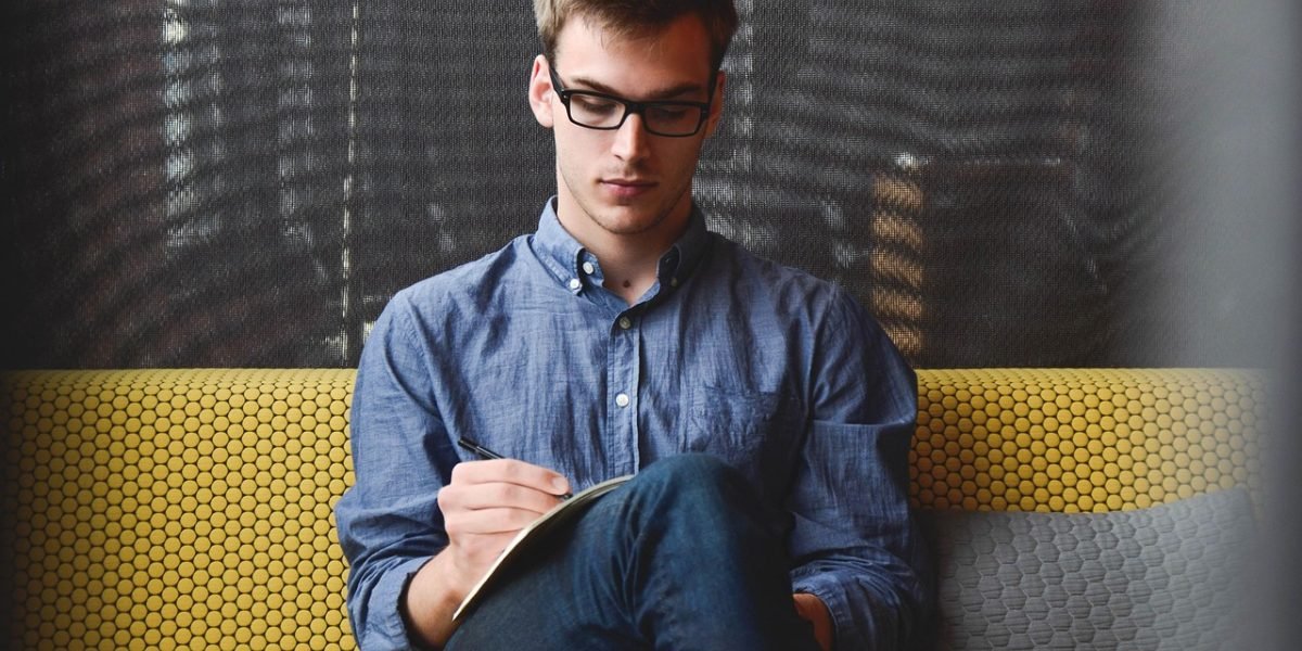 An entrepreneur looking thoughtfully at documents, symbolizing the critical impact of website performance on business success.