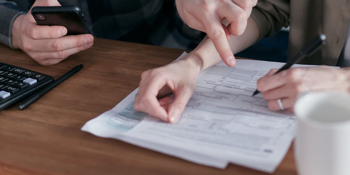 A person considering financial implications, representing the process of evaluating domain pricing and value.