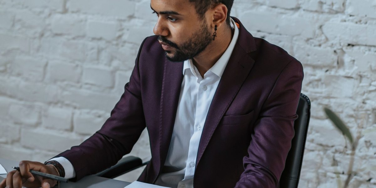 A business owner carefully weighing options to make a strategic decision for their website hosting.
