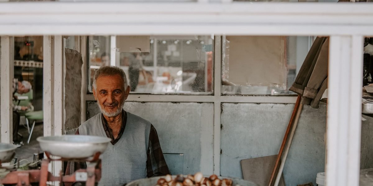 A person thoughtfully considering various business options, reflecting decisions about domain transfers or alternative services.