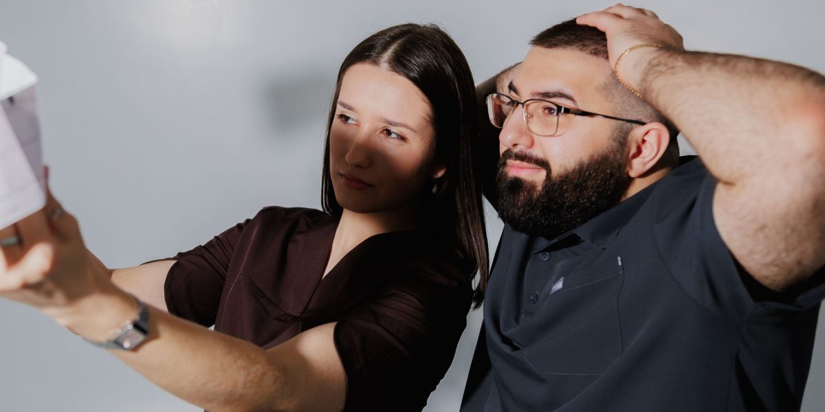 A person looking surprised or confused while reviewing a bill, symbolizing unexpected hidden costs.
