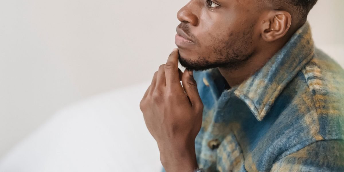 A person contemplating different options or alternatives, visually representing the decision-making process for choosing a new web host.