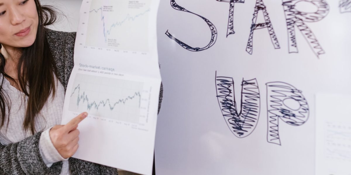 An entrepreneur thoughtfully planning their business strategy, emphasizing the foundational need for an online presence.