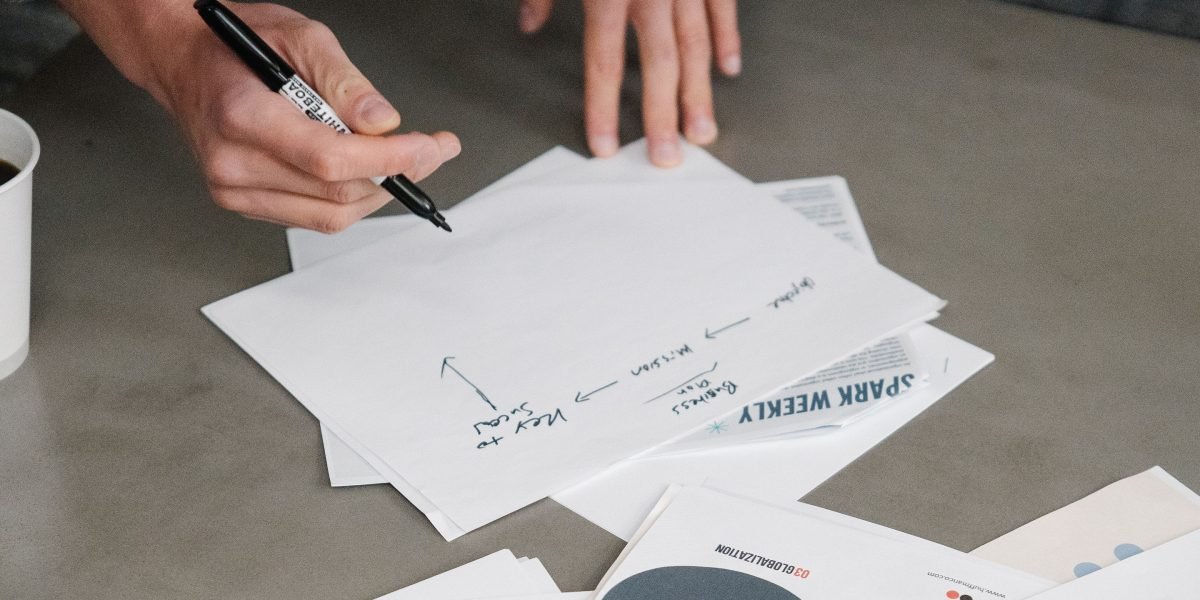 An entrepreneur thoughtfully planning their next business steps, highlighting the need for effective online tools.