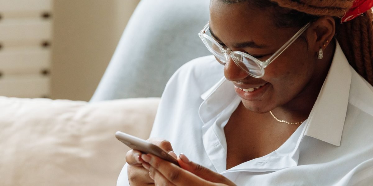 Depicts a satisfied user enjoying a fast and responsive website on their mobile device.