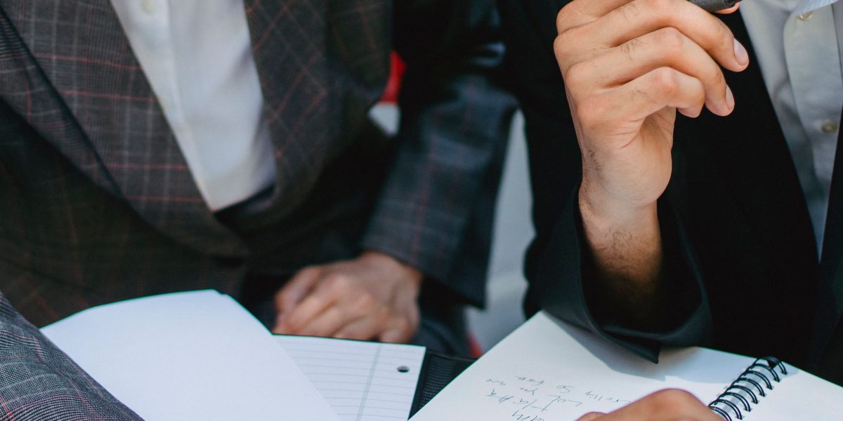 Entrepreneurs making a strategic choice for their online presence, balancing initial costs with long-term brand goals.