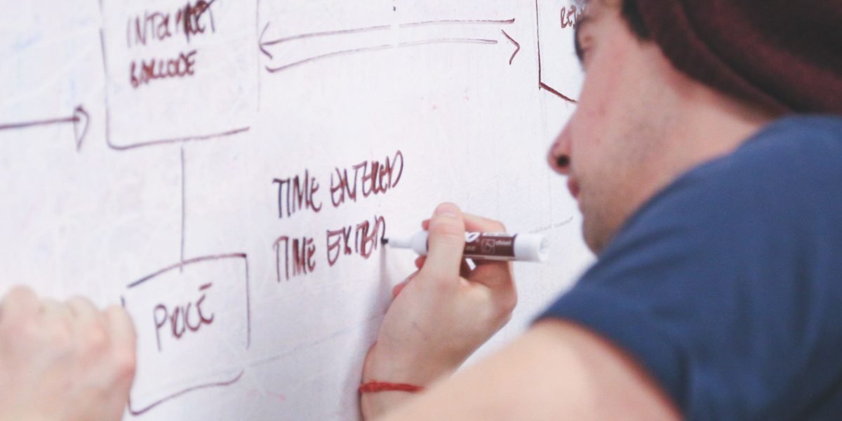 A person engaged in thoughtful planning, reflecting the strategic decisions involved in a website migration.