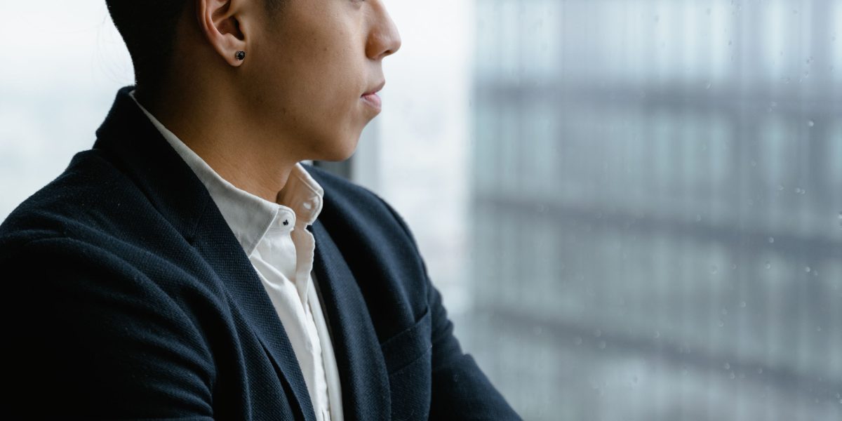 An entrepreneur deep in thought, making a critical business decision.