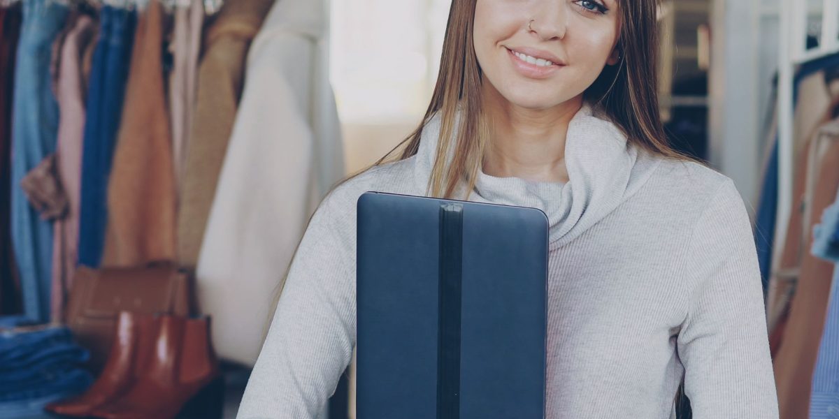 A business owner diligently comparing web hosting options on a laptop.