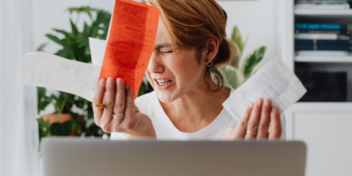 A small business owner looking stressed, likely due to a website issue.