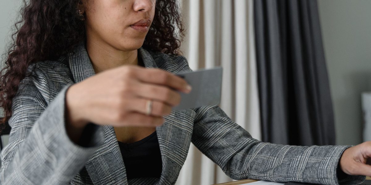 A small business owner carefully reviewing financial reports, illustrating the importance of understanding web hosting and cPanel costs for budgeting.