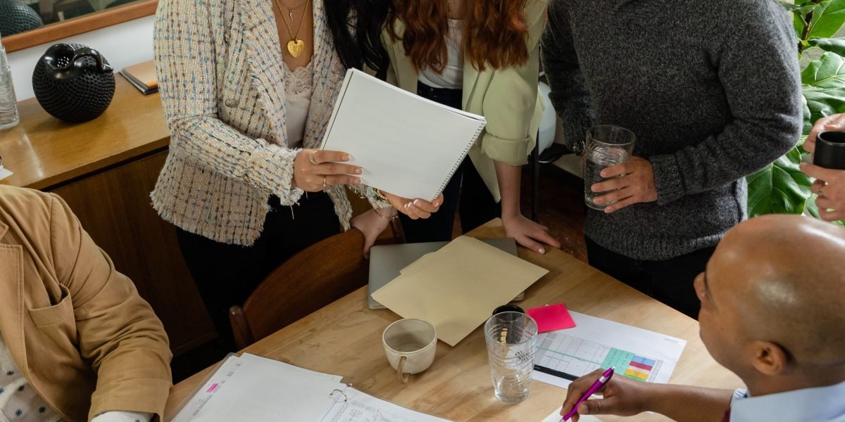 A team collaborates, brainstorming and making strategic decisions about a significant investment.