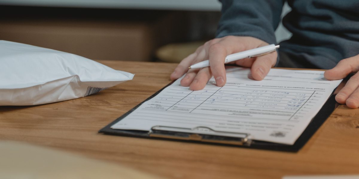 A person thoughtfully evaluating different options or a checklist to make an informed decision.