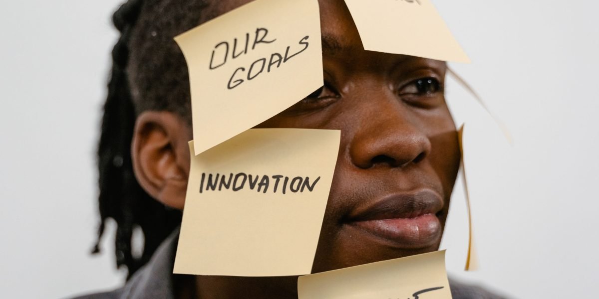 An entrepreneur thoughtfully considers various options for their business's online presence.