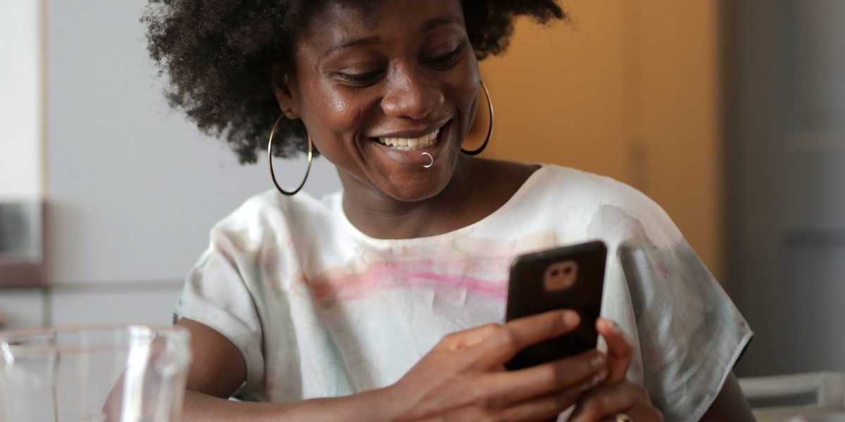 A person experiencing a fast-loading website on their phone, illustrating the positive impact of good website speed.