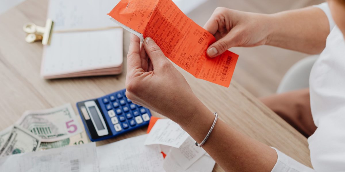 A person carefully reviewing financial documents, emphasizing the importance of understanding costs and avoiding surprises.