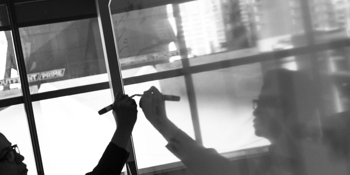 A small business owner contemplating critical choices for their online brand's foundation.