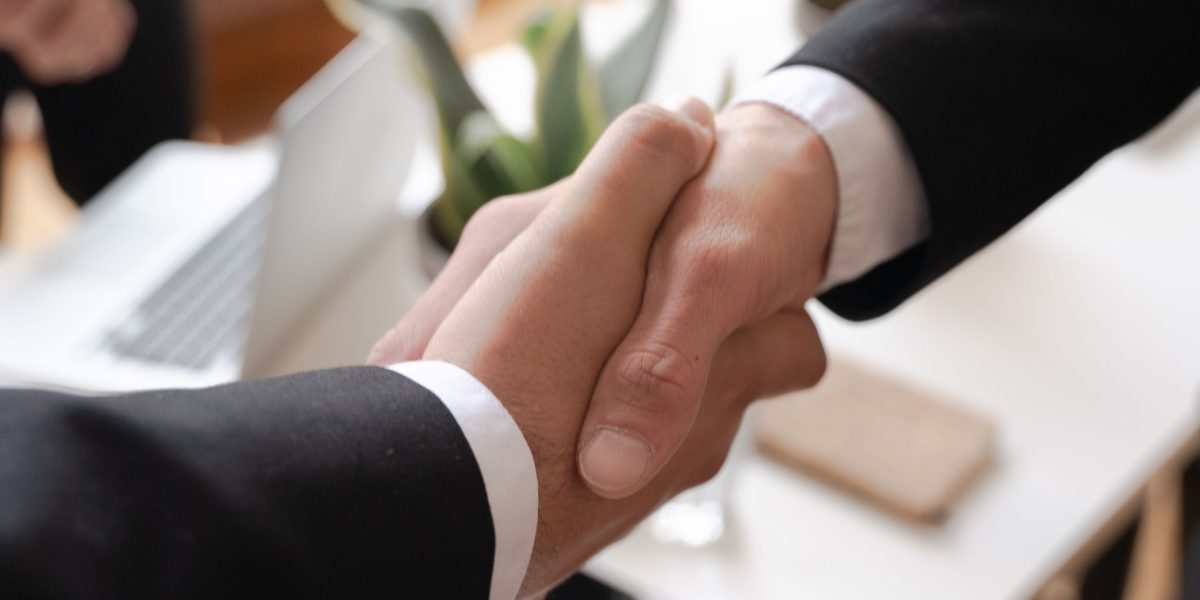 Professionals engaging in a negotiation discussion.